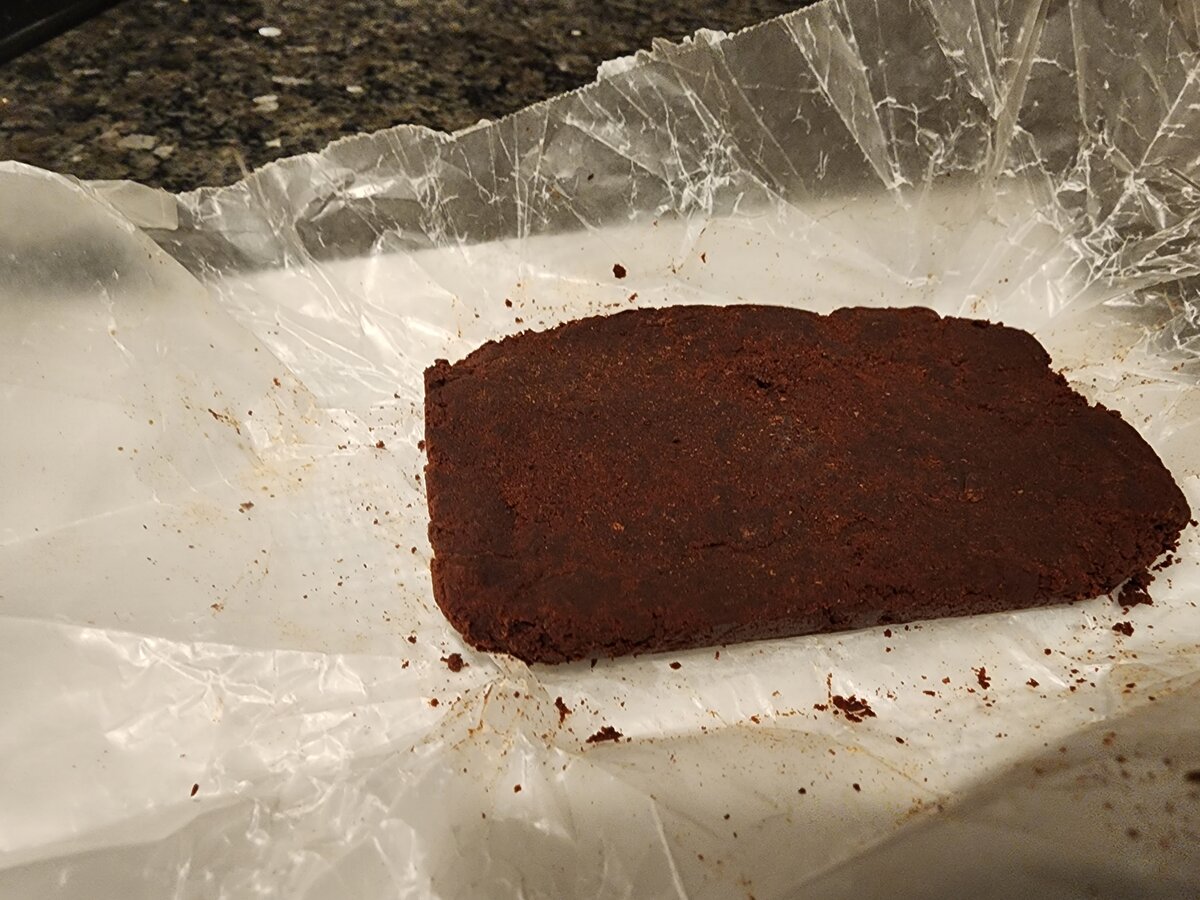 Grinding cocoa nibs into smooth paste